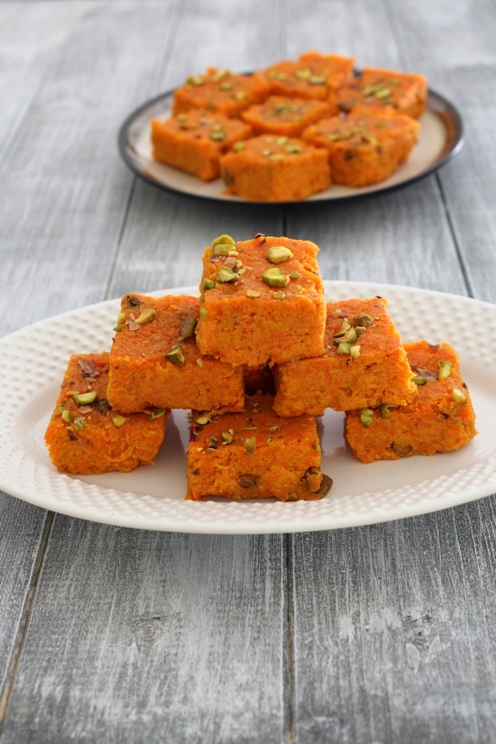 a stack of carrot burfi in a plate.