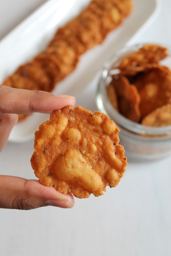 Holding one masala puri in your hand.