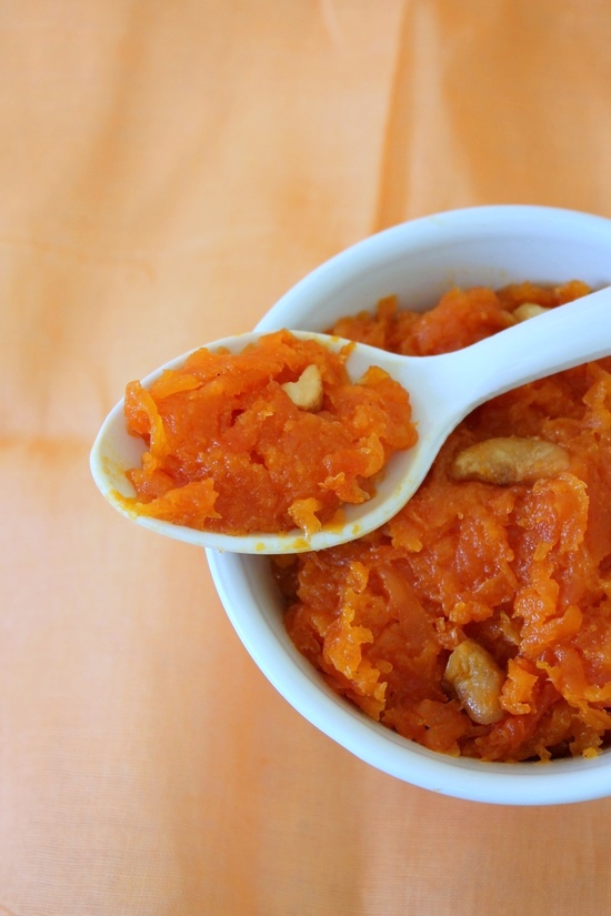 A spoonful of Papaya halwa resting on the bowl.