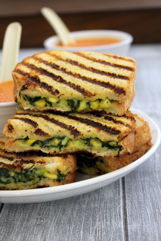 A stack of spinach corn sandwich in a plate.