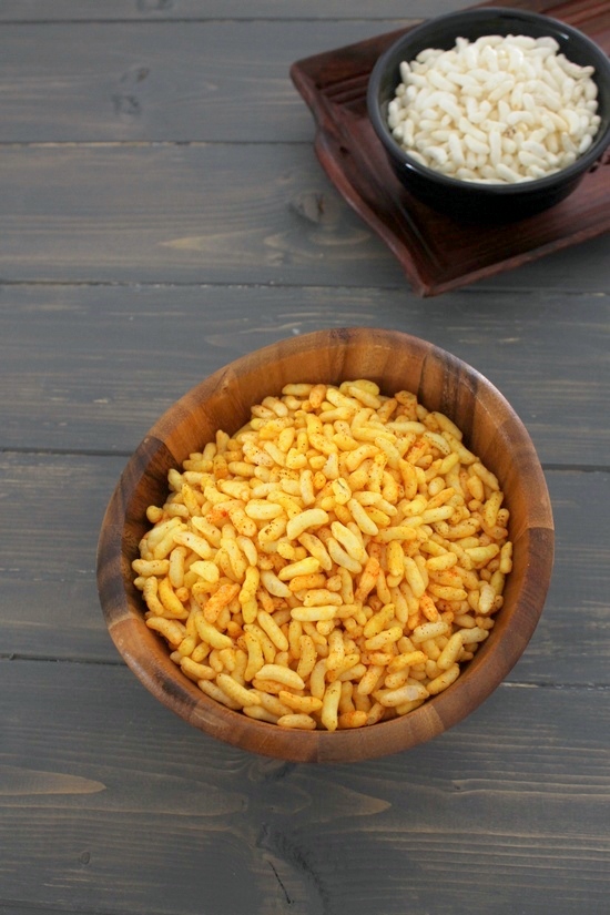Vagharela mamra in a wooden bowl with plain mamra bowl in the back with a tray.