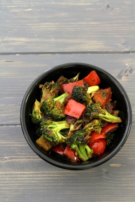 Broccoli sabzi rserved in a black bowl.