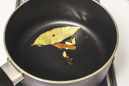 tempering whole spices into the ghee