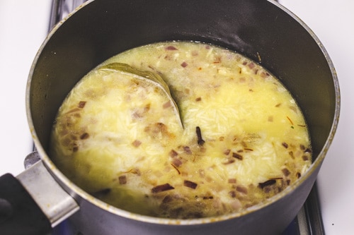 adding water and saffron-milk rice