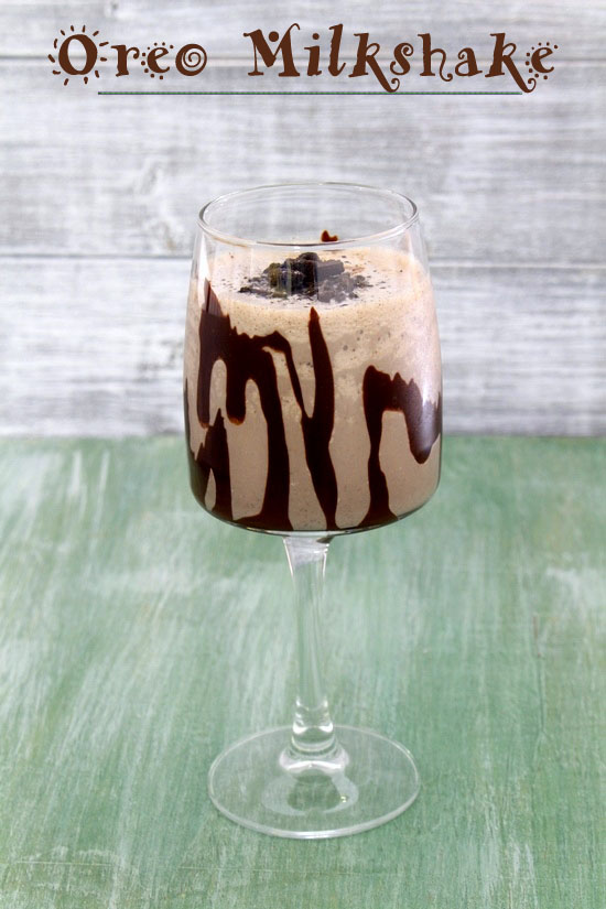 Oreo milkshake in a tall glass.