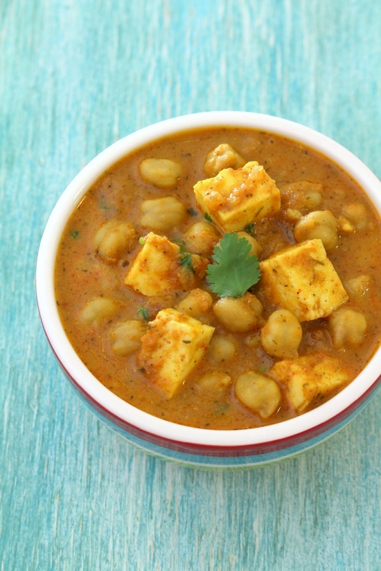 Chana paneer served in a bowl.