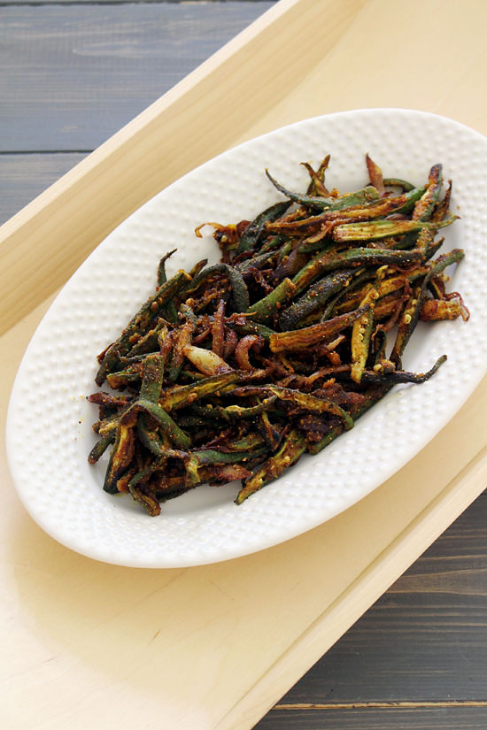 Bhindi fry in an oval plate.