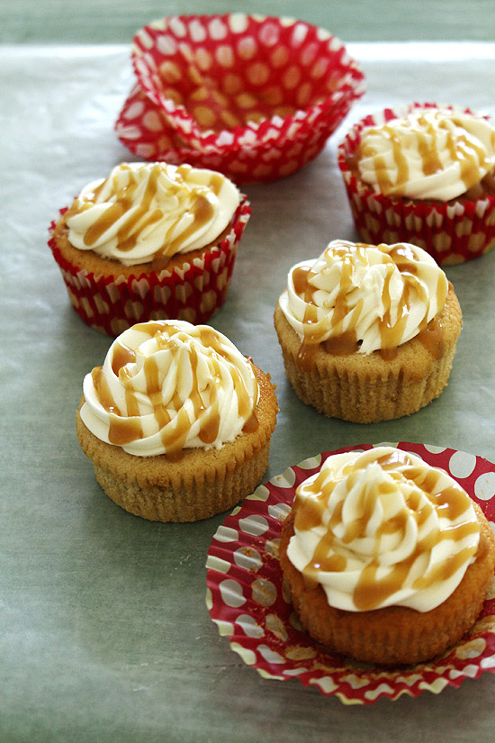 Eggless butterscotch cupcake with a liner removed.