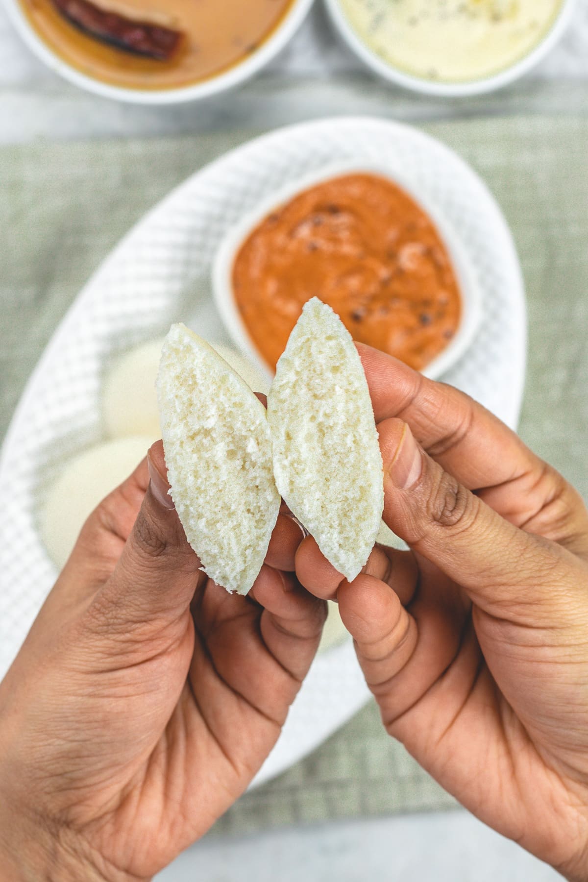 Showing idli texture by cutting into half.