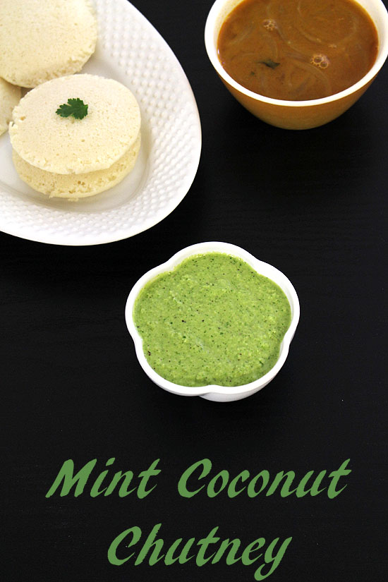 Pudina coconut chutney with idli and sambar in the back.