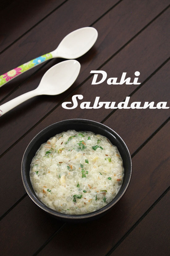 A bowl of dahi sabudana with 2 spoons on the side.