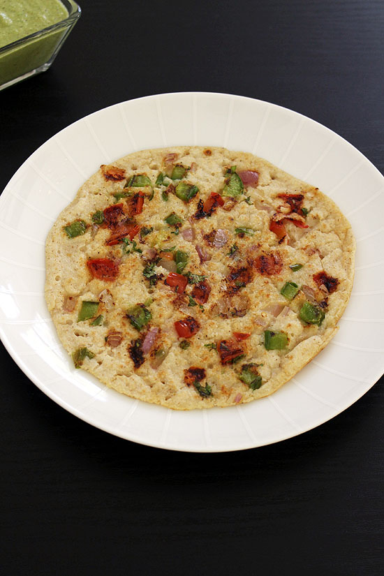 Oats uttapam in a plate.