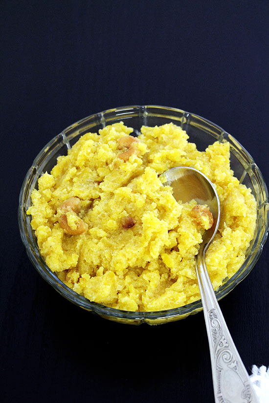 Pumpkin halwa bowl with a spoon in it.