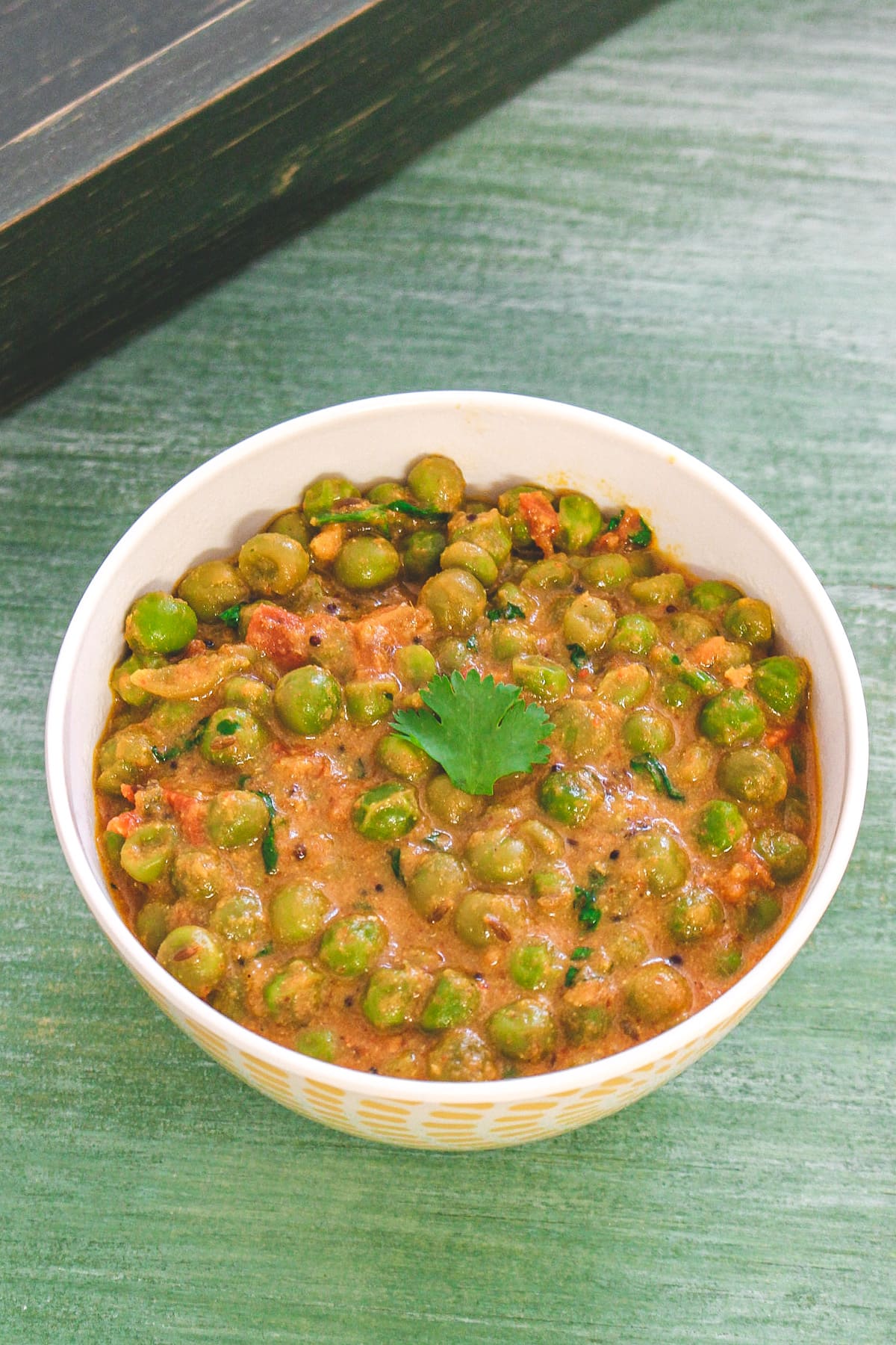 Dry green peas sabzi served in a bowl.