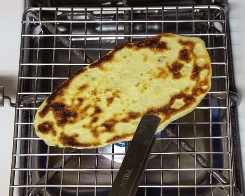 roasting the naan on direct flame