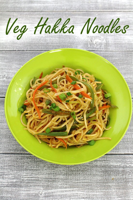 Hakka noodles served in a green plate. 