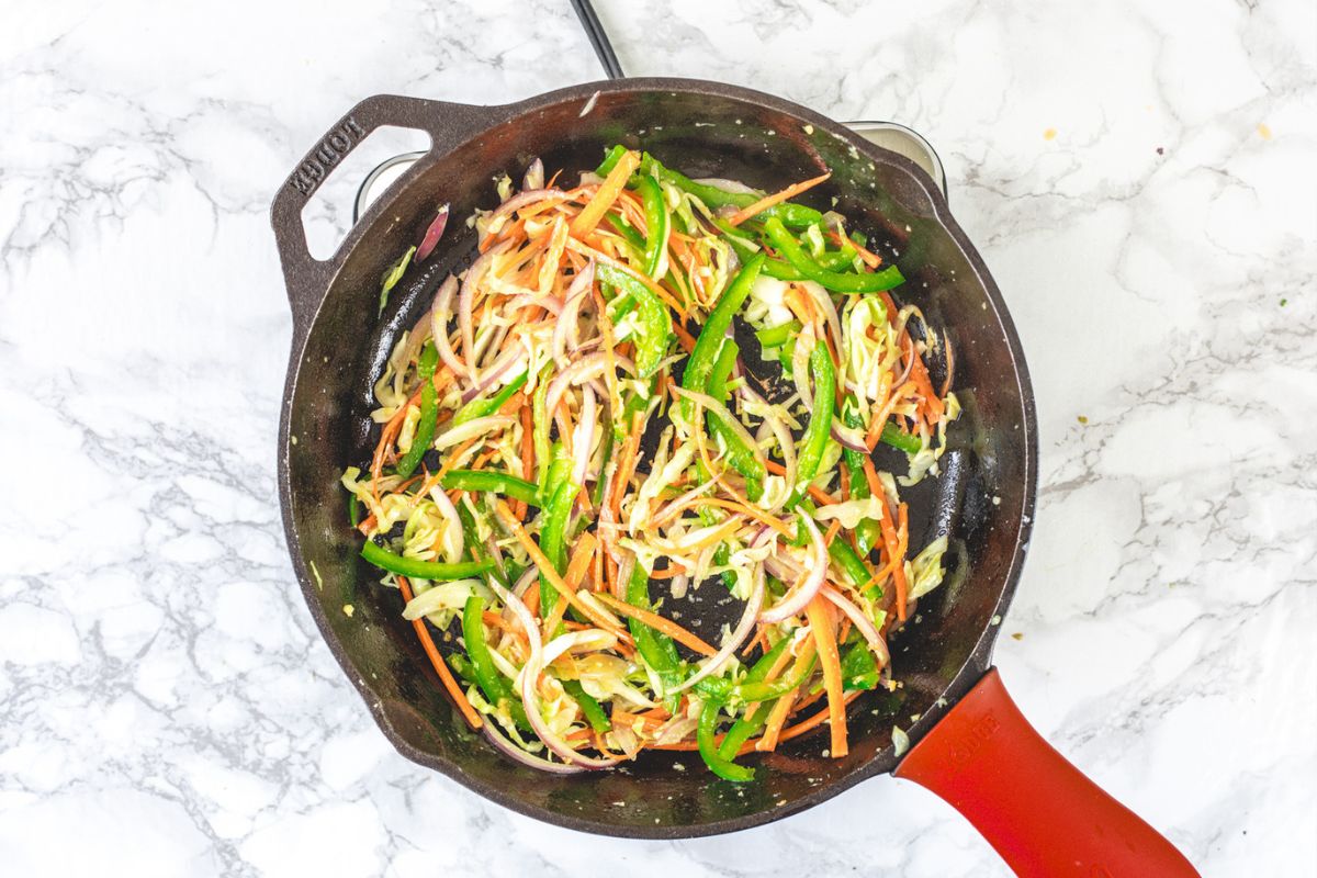 Sauteing veggies for veg hakka noodles.