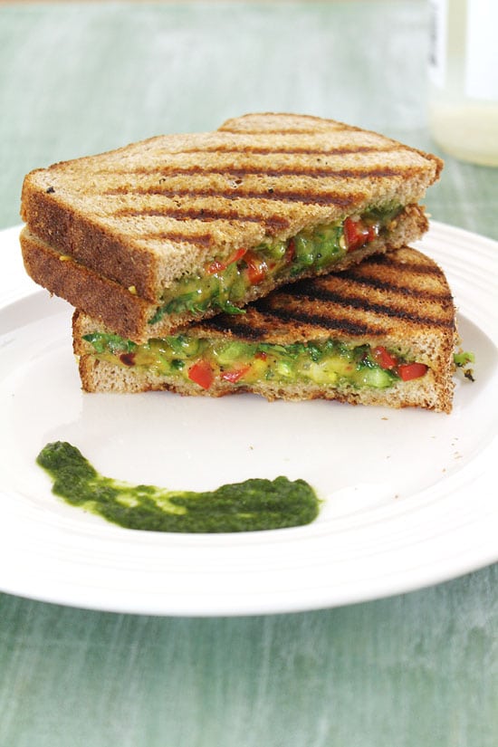 Chilli Cheese Sandwich in a plate with green chutney. 