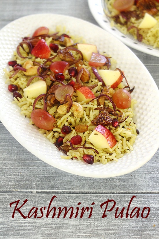 Kashmiri pulao in a white oval plate.