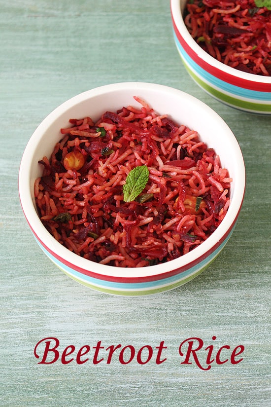Beetroot rice in a bowl garnished with mint leaf.