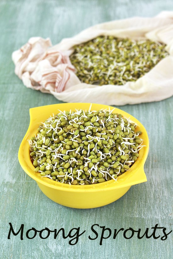 Moong sprouts in a yellow bowl and more sprouts in a napkin in the back.
