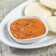 Tomato chutney served with idli.