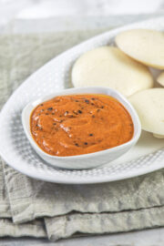 Tomato chutney served with idli.