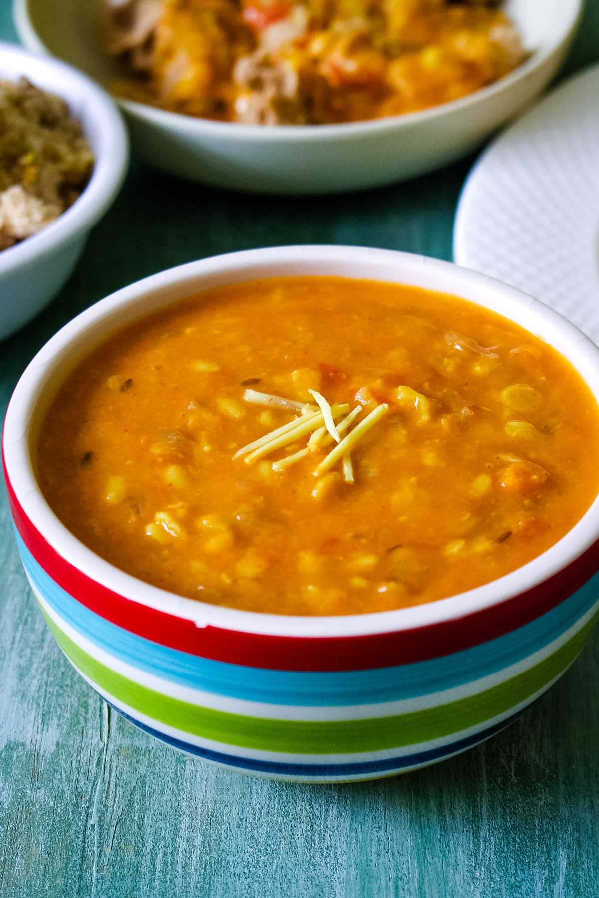 Panchmel dal bowl garnished with julienne ginger.