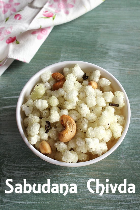 Sabudana  chivda served in a bowl with napkin in the back.