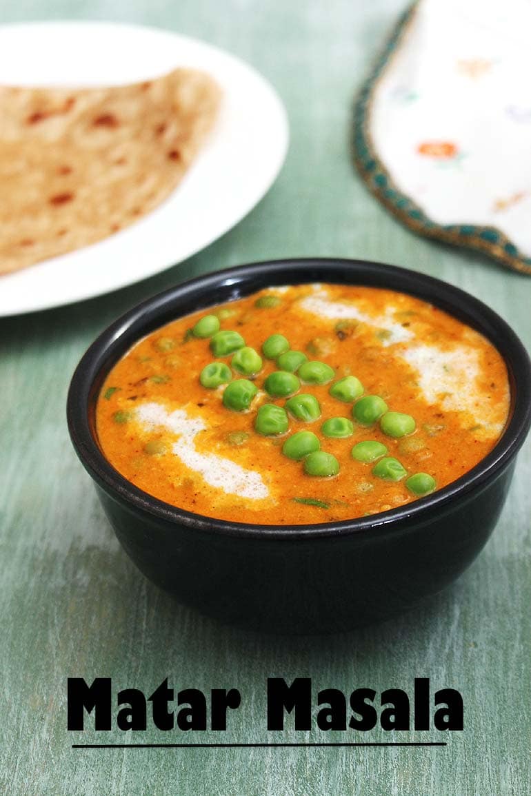 green peas curry served with paratha in the back.