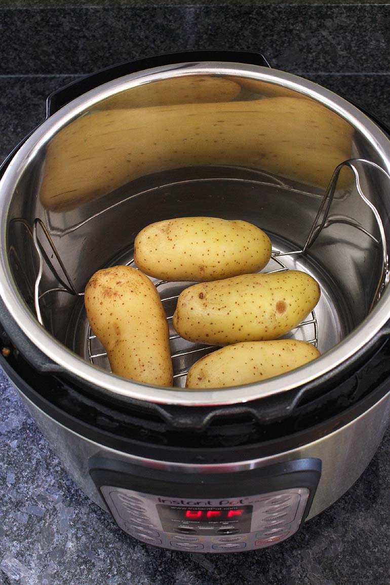 4 potatoes in instant pot on the rack.