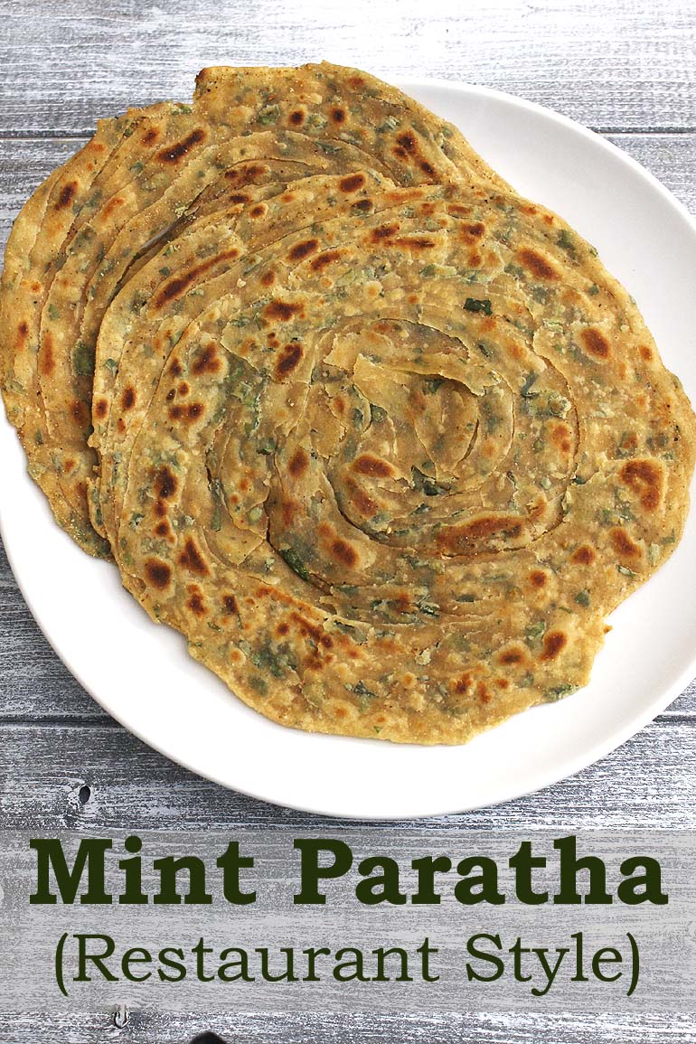 2 mint paratha served in a plate.