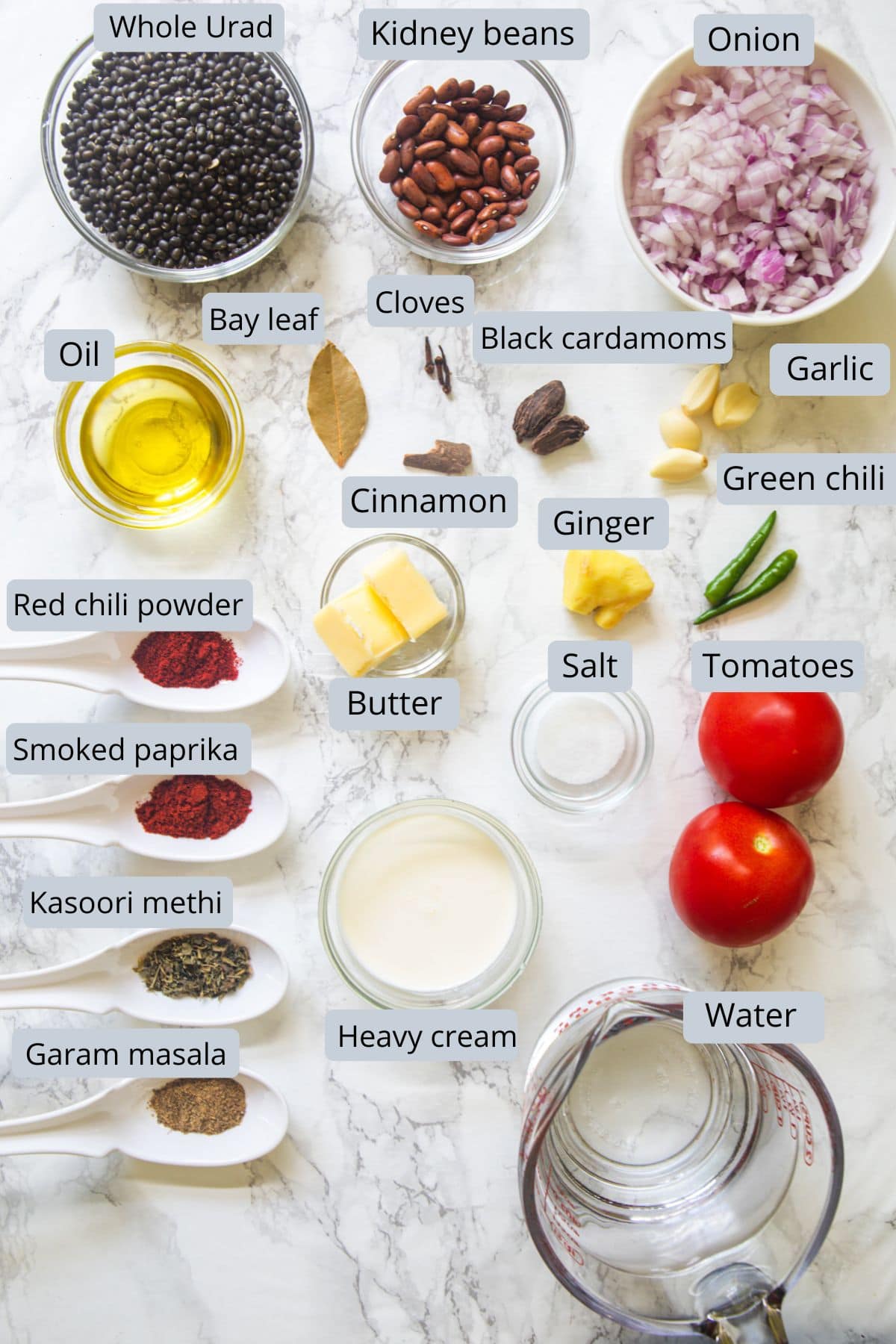 Instant pot dal makhani recipe ingredients in bowls and spoons with labels.