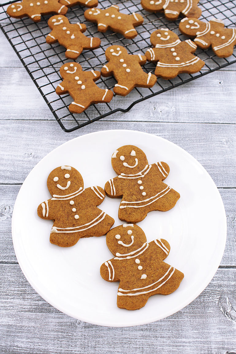 Eggless gingerbread girls cookies on a plate.