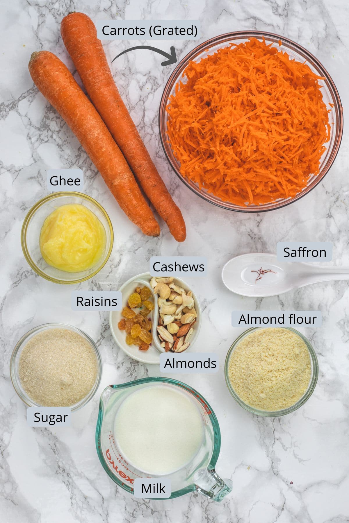 Instant pot gajar halwa ingredients in bowls and spoons with labels.