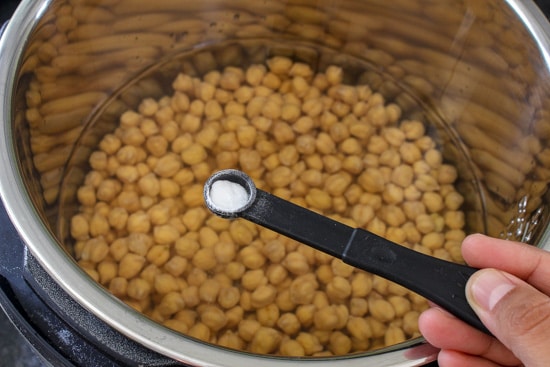 adding baking soda to the chickpeas