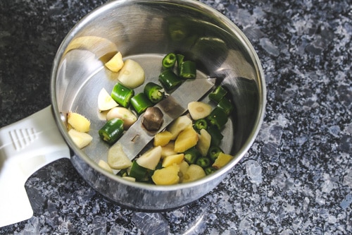 ginger, garlic, green chilies in a grinder jar