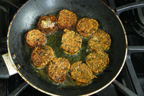 kothimbir vadis are fried till crispy and light golden in color