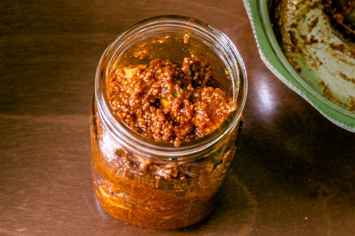 transferring the methia keri pickle into the glass jar