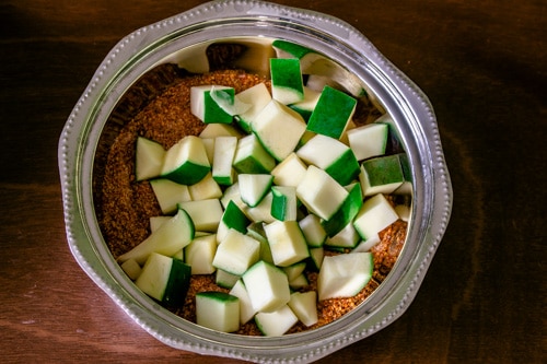raw mango cubes are added to the spice mixture