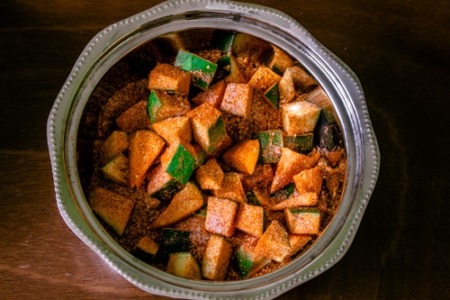 mango pieces are coated with pickle masala