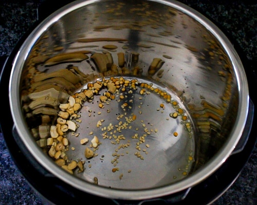 tempering mustard seeds, dal and cashews