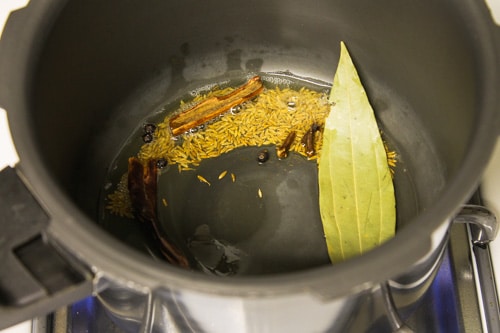 adding whole spices in the tempering