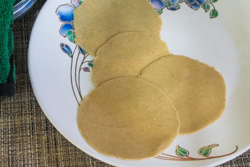 few rolled pooris in a plate