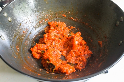 pureed tomatoes are cooked for tomato rice recipe