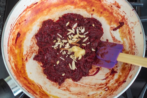 adding ghee and nuts