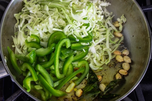 adding cabbage and green pepper