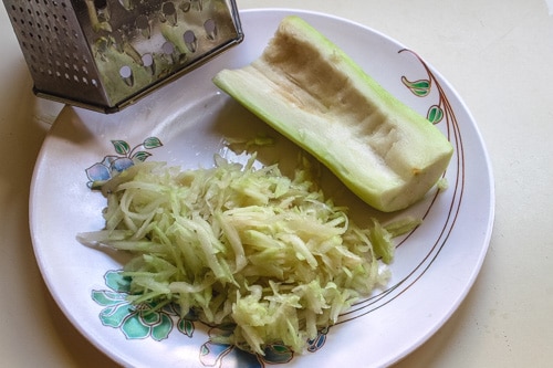 grating the bottle gourd