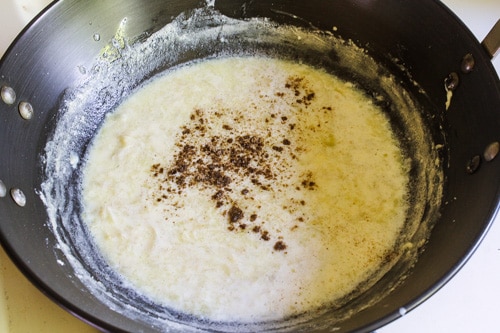 adding cardamom powder