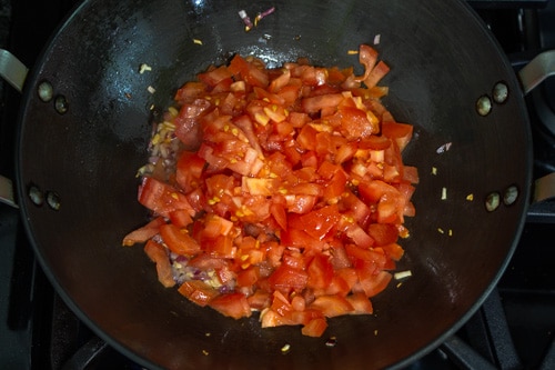 adding tomatoes